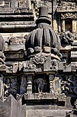 Prambanan - Candi Lara Jonggrang, miniature shrines surmounted by small fluted stupa with panels with musicians and dancers decorating the top of the balustrade 